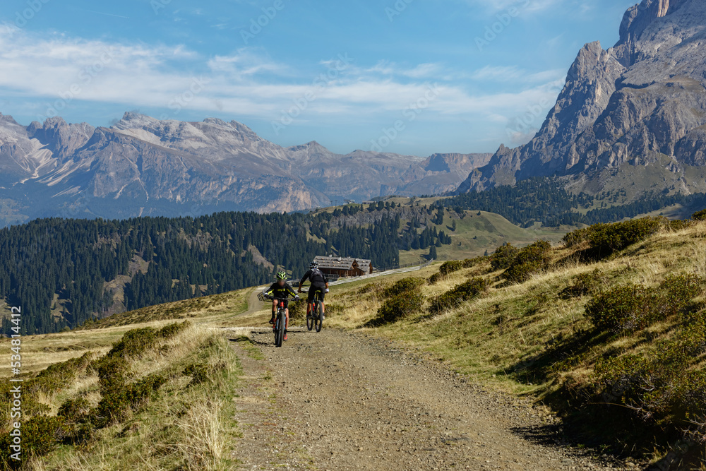 Bikers on mountainous trail. Summer Trekking in Dolomites