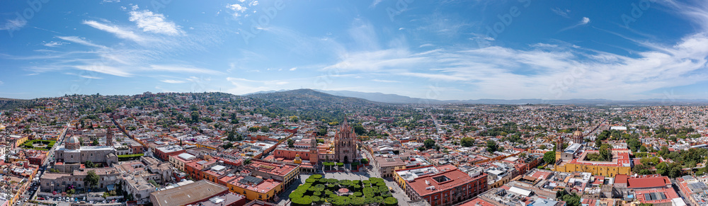 Aerial: scenic cityscape and landscape in San Miguel de Allende. Drone view