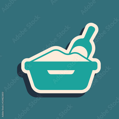 Green Cat litter tray with shovel icon isolated on green background. Sandbox cat with shovel. Long shadow style. Vector