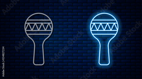 Glowing neon line Maracas icon isolated on brick wall background. Music maracas instrument mexico. Vector