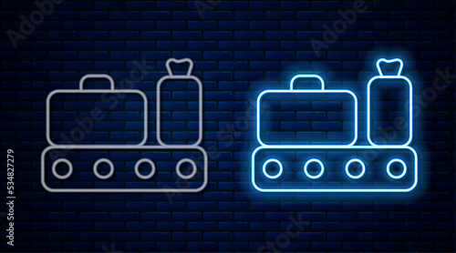 Glowing neon line Airport conveyor belt with passenger luggage, suitcase, bag, baggage icon isolated on brick wall background. Vector