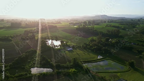 Countryside aeroview with farm fields on sunset