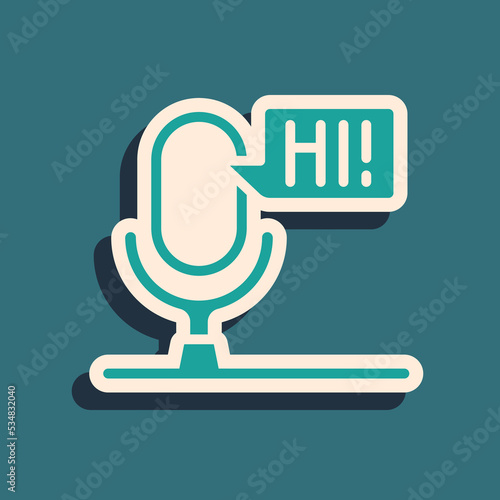 Green Microphone voice device icon isolated on green background. Microphone interpreter and alphabet letters. Long shadow style. Vector