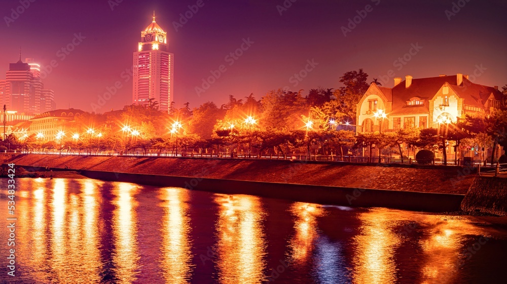 Beautiful night scenery of Qingdao seaside city in the background,china