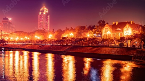 Beautiful night scenery of Qingdao seaside city in the background,china