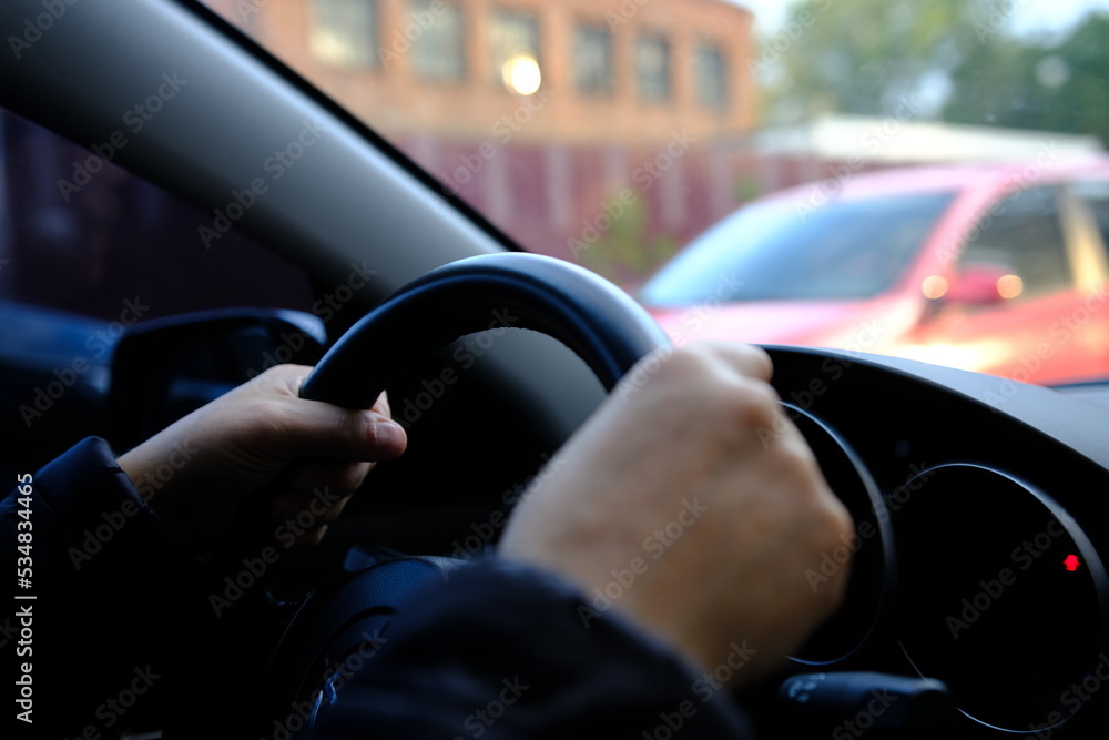 Hand of man driving inside car selective focus Hand of man driving inside car selective focus