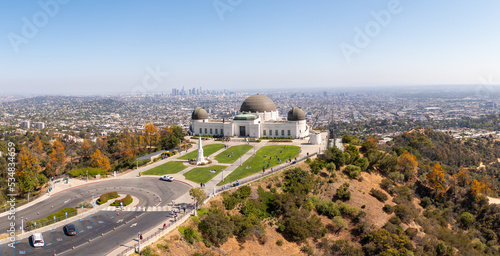 Tela Aerial: Los Angeles cityscape and Griffith park. Drone View