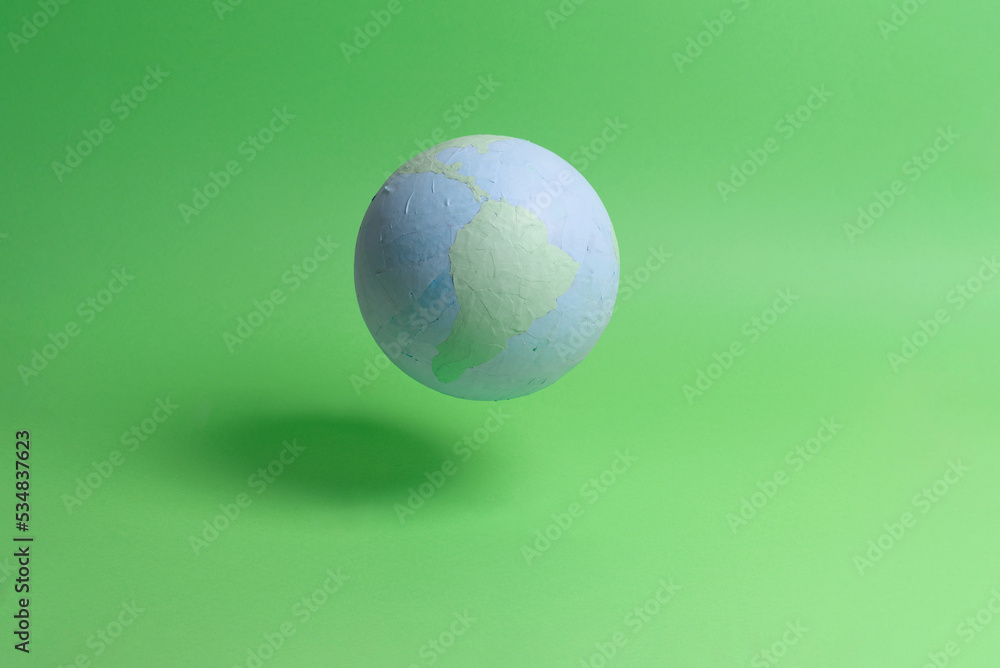 planet earth on green background, room for copy space
