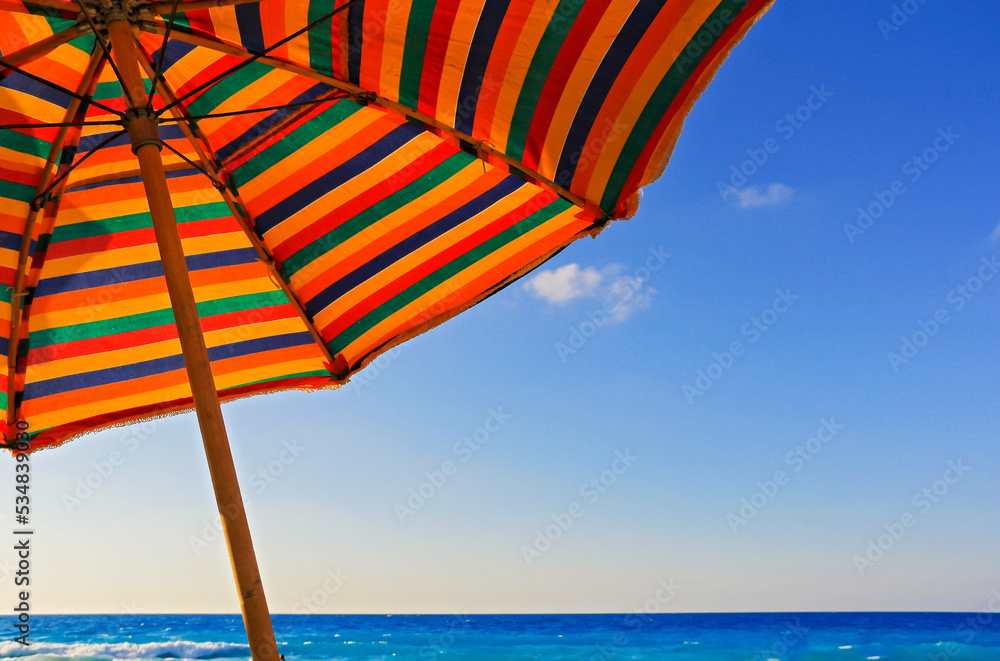 vibrant colorful umbrella on the beach