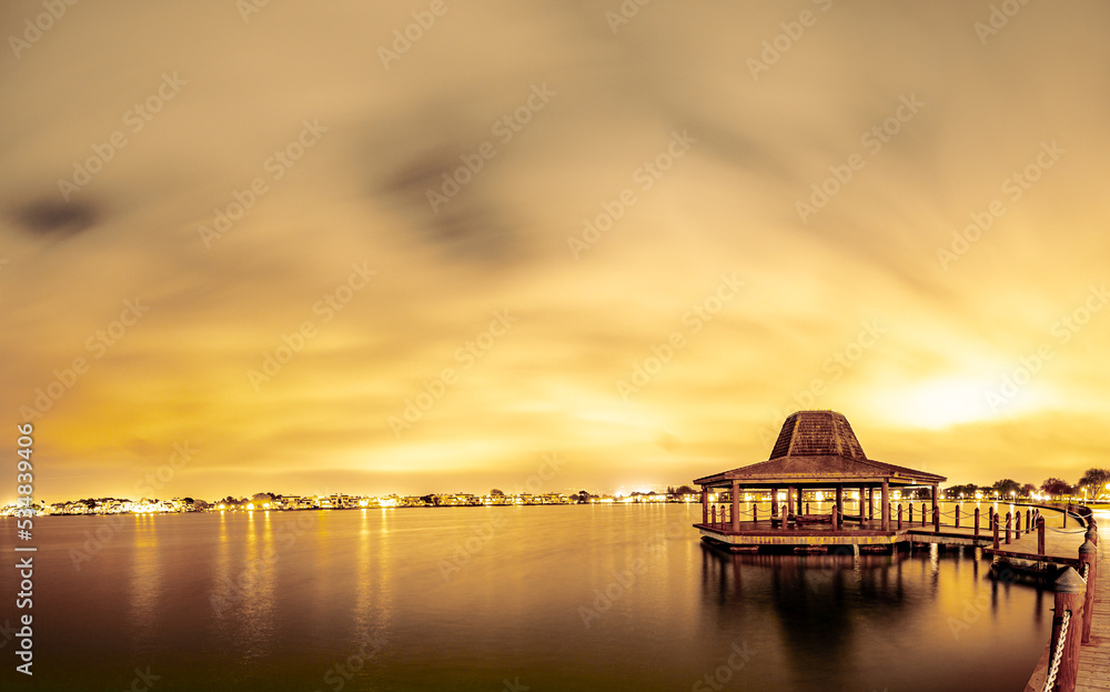 Amazing gazebo structure by the lagoon at night

