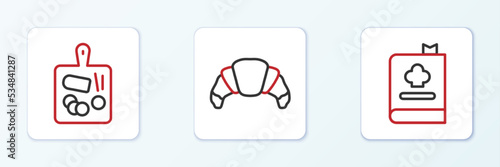 Set line Cookbook, Cutting board and Croissant icon. Vector