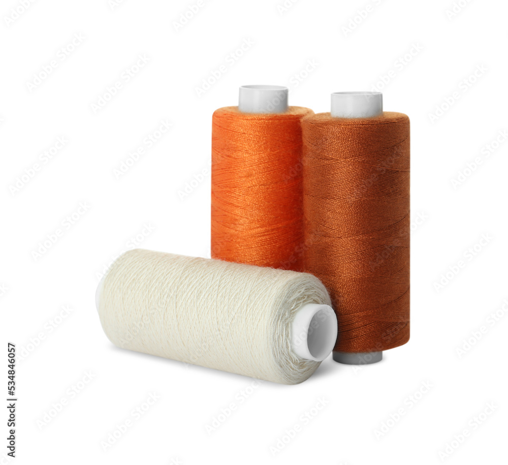 Different colorful sewing threads on white background Different colorful sewing threads on white background