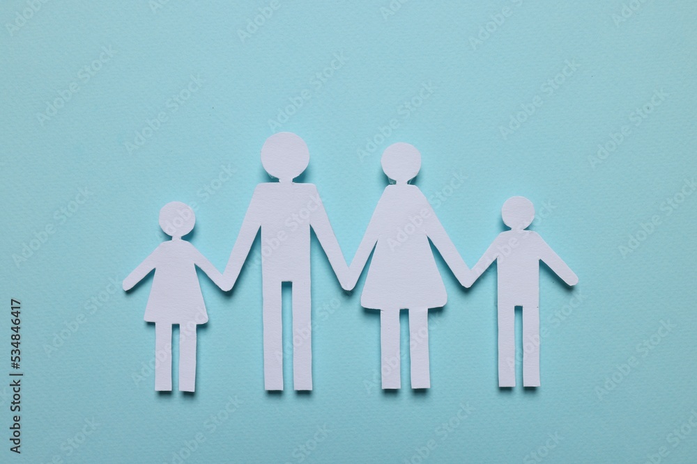 Paper family figures on light blue background, top view. Insurance concept Paper family figures on light blue background, top view. Insurance concept