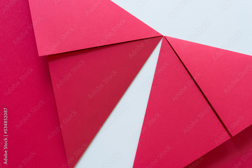 two sheets of red paper folded on blank paper