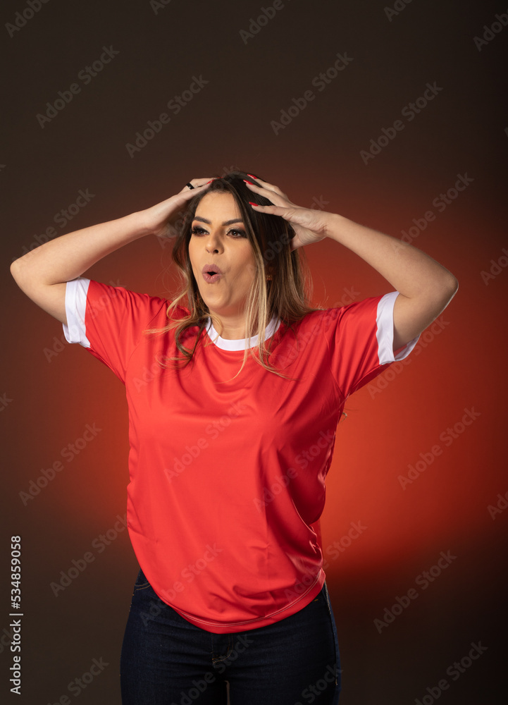 woman soccer fan cheering for her favorite club and team. world cup red background woman soccer fan cheering for her favorite club and team. world cup red background