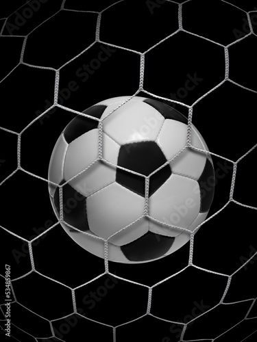 Shoot soccer ball in goal, net on black isolated background © Retouch man
