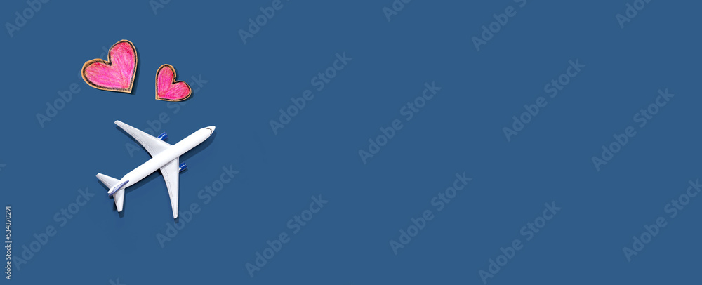 Fototapeta premium Flights booking and reservation theme with airplane and hearts