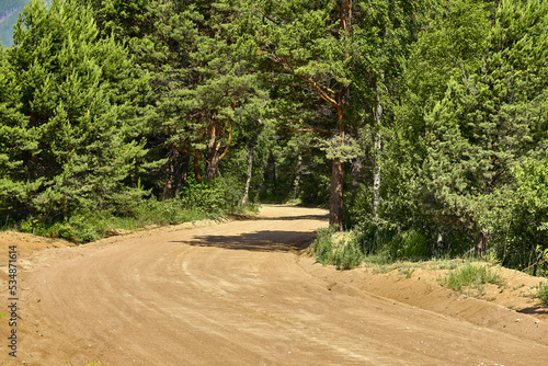 The road to the Holy Nose peninsula of Lake Baikal in the Republic of Buryatia during the day with a clear sun. photo