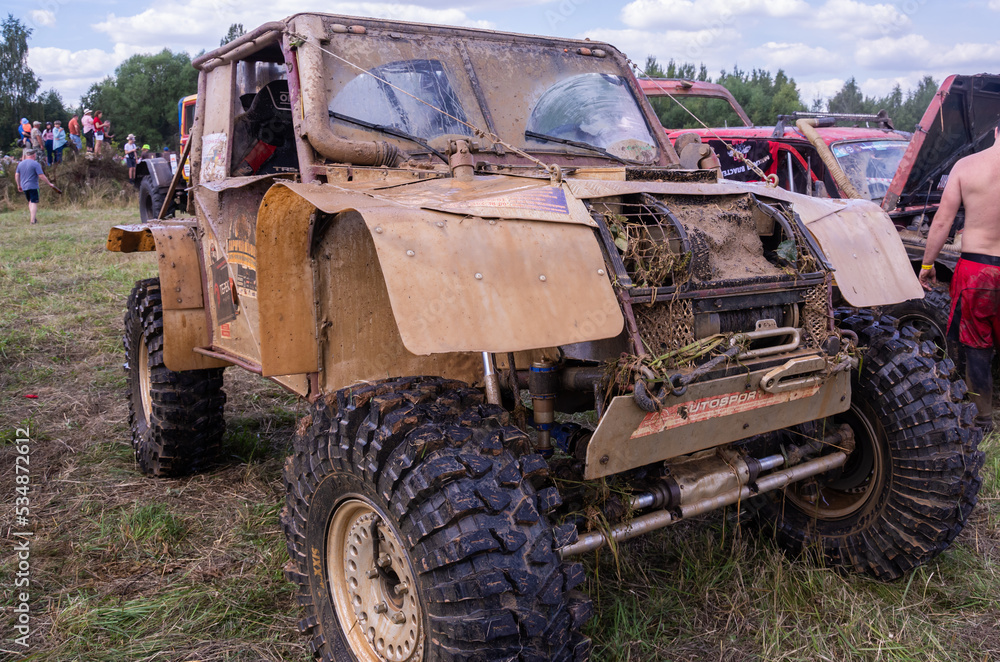 Exhibition of cars - titans, participants of the race. Large-scale sports competitions of off-road cars 