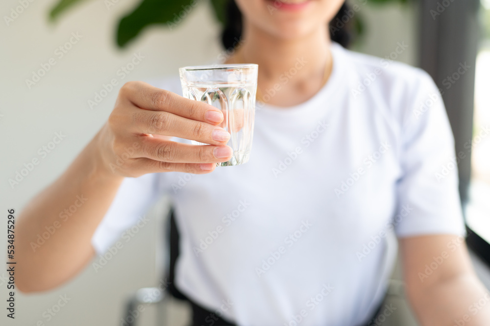 person holding glass of water person holding glass of water