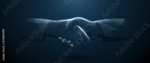 Business handshake is made from lines, triangles, low polygon, and particle style. Vector illustration