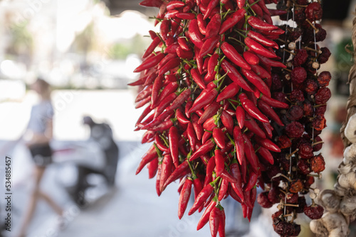 Calabrian red pepper in Tropea street market. Traditional unique ingredient in Calabria's cuisine, symbol of region. Travel in Calabria concept, southern Italy.