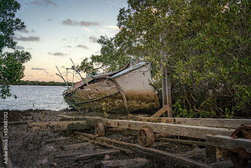 An old abandoned boat is left to it's fait in the elements