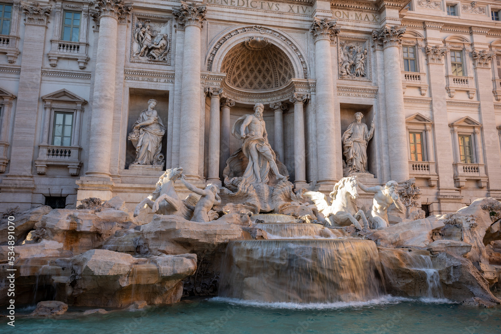 The Trevi's Funtain, in the Center of Rome, At Sunset with Parts of it Illuminated By the Sun