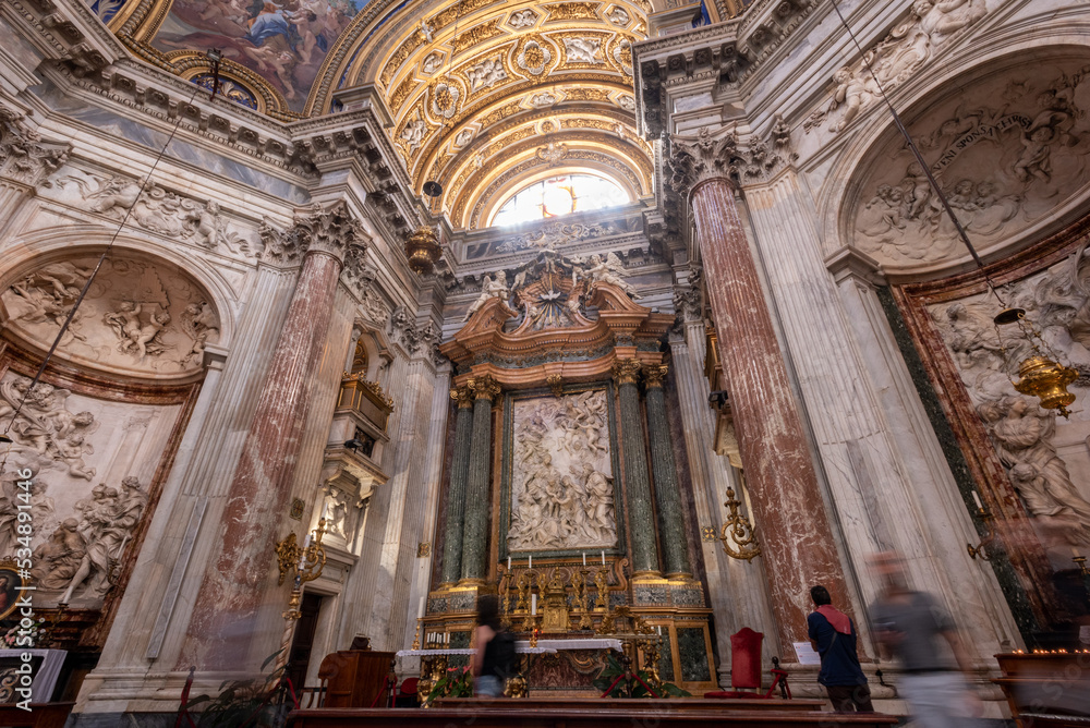 Long Exposition Shot of the Internal of the Church of Sant'Agnese in Agone with Blurred People in the Centre of Rome