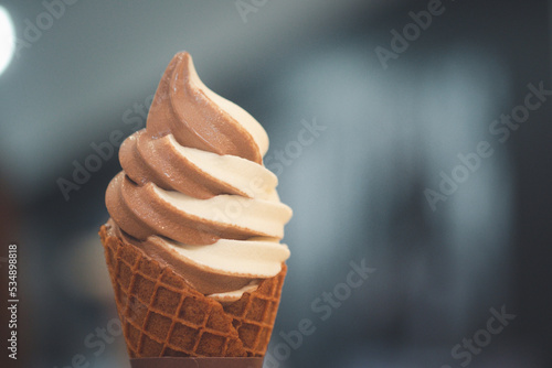 Obraz na plátně Mixed flavor ice cream cone soft serve in waffle cone