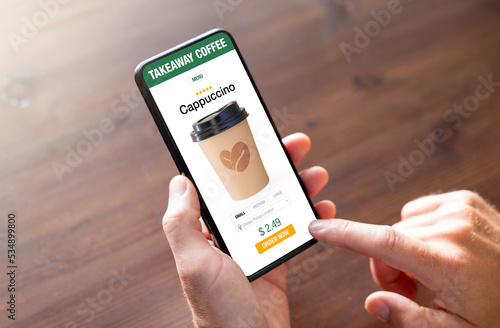 Photos Person ordering coffee online for takeaway on mobile phone
