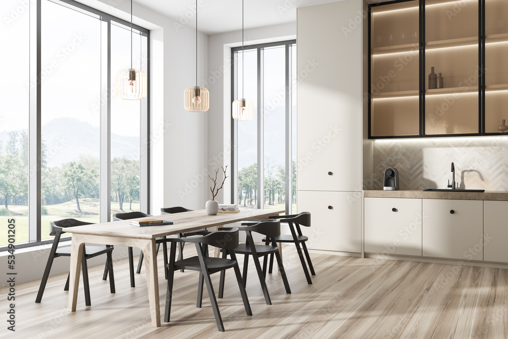 Fototapeta premium Stylish kitchen interior with table and seats, dining area and window