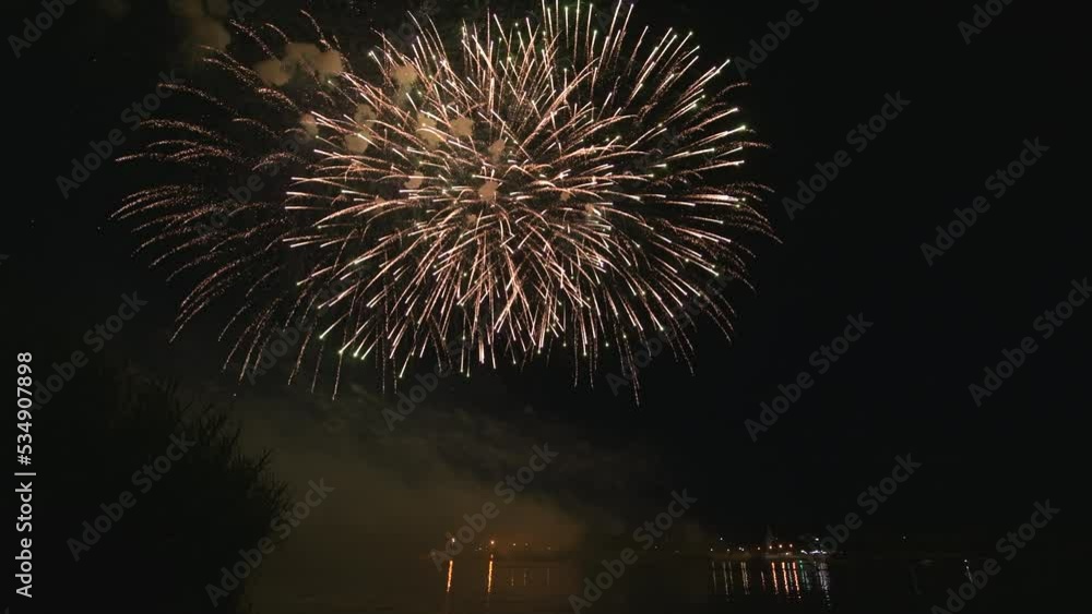 Awesome Real Firework on Deep Black Background Sky on Fireworks festival from river bank over night city lights in summer on 4th of July, Independence day in USA. High quality 4k raw video Awesome Real Firework on Deep Black Background Sky on Fireworks festival from river bank over night city lights in summer on 4th of July, Independence day in USA. High quality 4k raw video