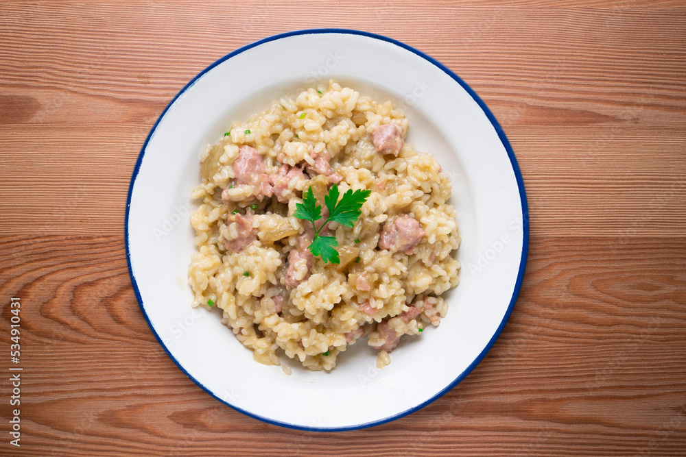 Catalan butifarra sausage risotto with parmesan. Mixed Spanish and Italian recipe. Catalan butifarra sausage risotto with parmesan. Mixed Spanish and Italian recipe.