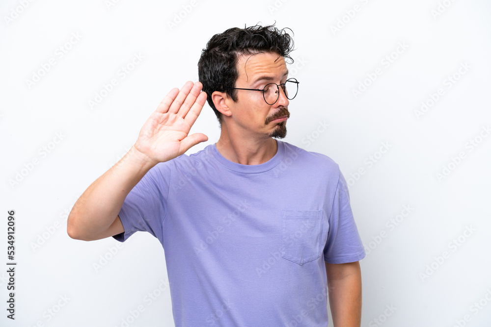Young man with moustache isolated on white background making stop gesture and disappointed Young man with moustache isolated on white background making stop gesture and disappointed