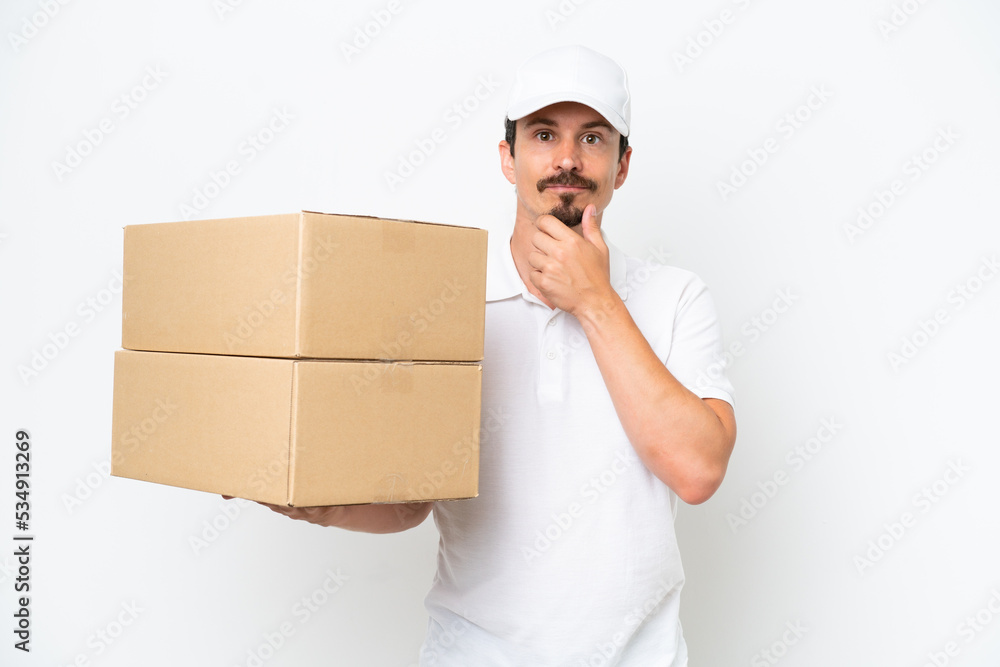Delivery caucasian man isolated on white background thinking Delivery caucasian man isolated on white background thinking