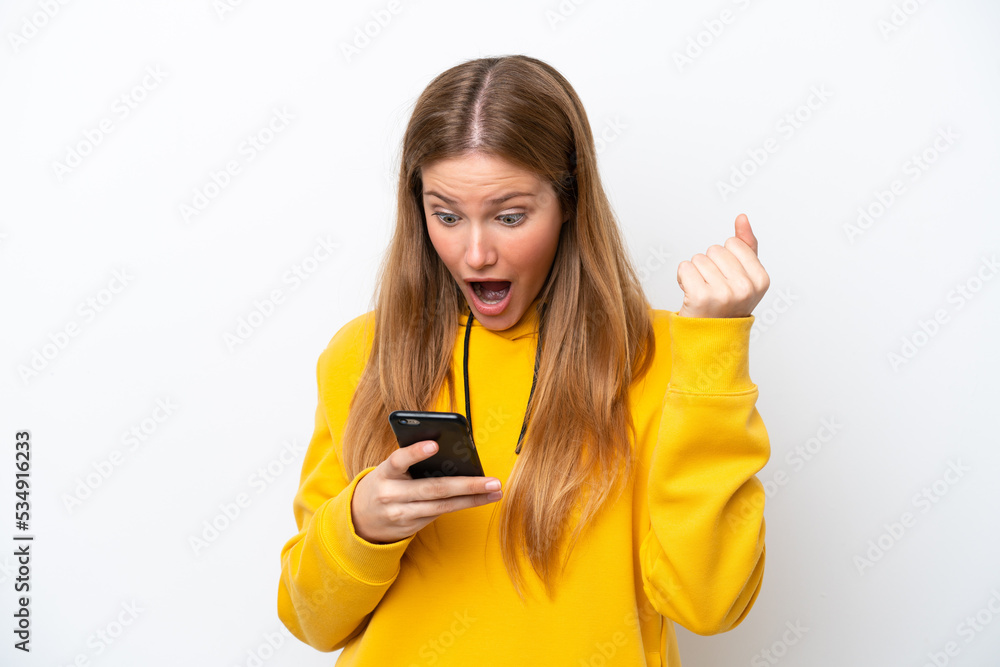 Young caucasian woman isolated on white background surprised and sending a message Young caucasian woman isolated on white background surprised and sending a message