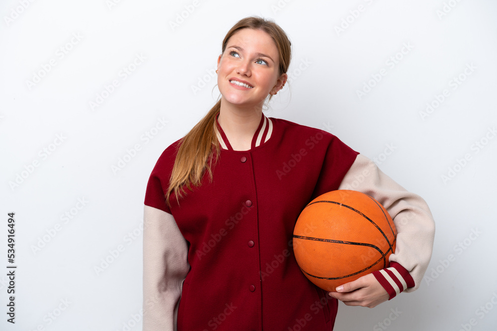 Young basketball player woman isolated on white background thinking an idea while looking up