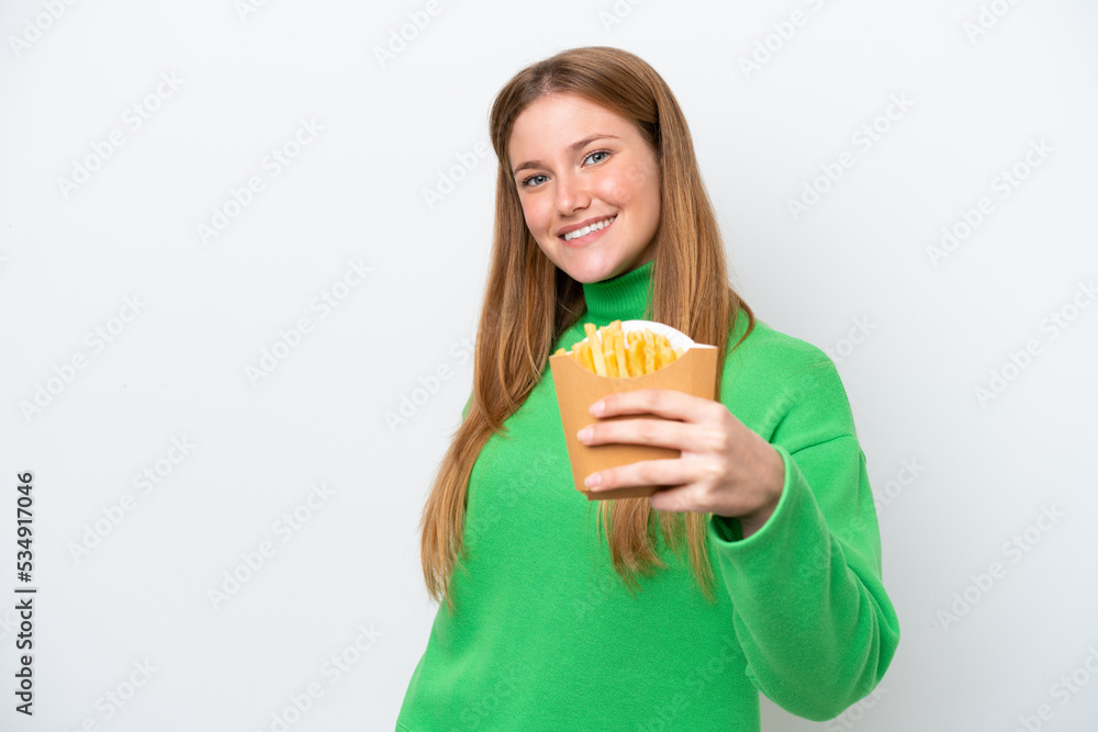 Young caucasian woman holding fried chips isolated on white background with happy expression