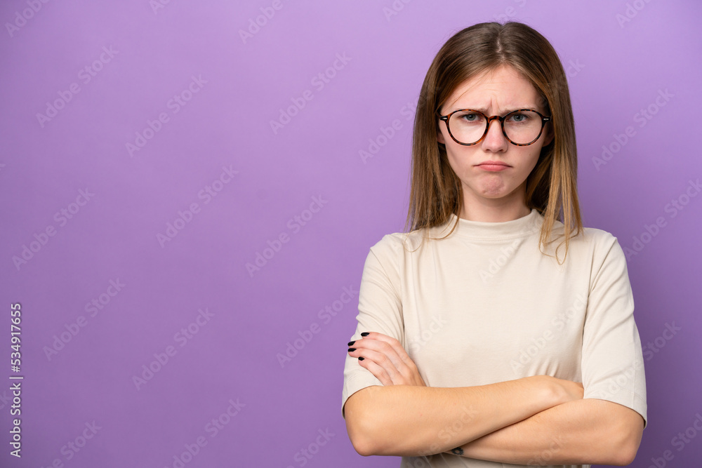 Young English woman isolated on purple background with unhappy expression Young English woman isolated on purple background with unhappy expression