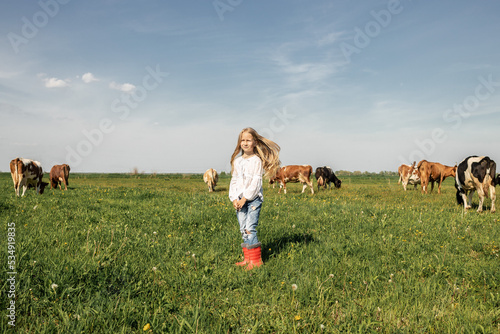 blonde girl in the field with cows  Happy Farmer children family