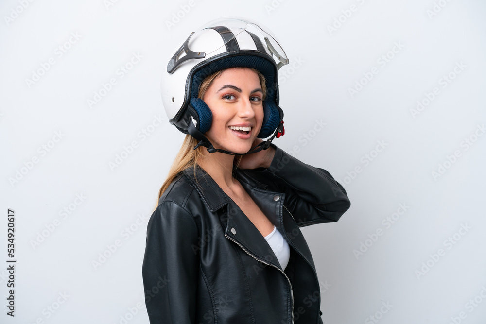 Young caucasian woman with a motorcycle helmet isolated on white background laughing Young caucasian woman with a motorcycle helmet isolated on white background laughing