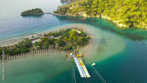 Flying above Oludeniz beach blue Lagoon. Beautiful bay with crystal blue water.  photo