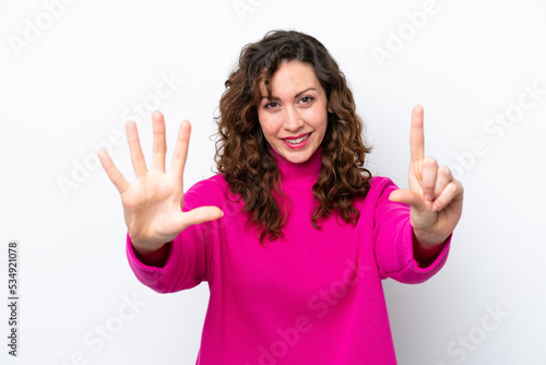 Young caucasian woman isolated on white background counting seven with fingers