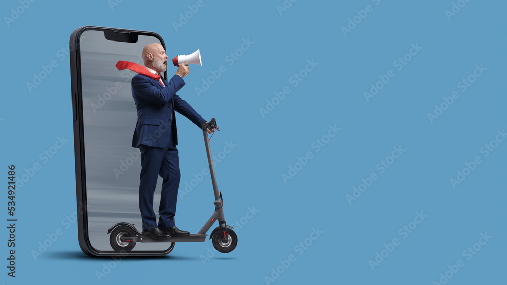 Businessman riding a scooter and coming out from a smartphone Businessman riding a scooter and coming out from a smartphone