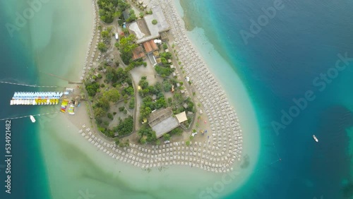 Flying above Oludeniz beach blue Lagoon. Beautiful bay with crystal blue water.  photo