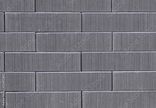 Brick wall texture seamless. Gray striped stone pattern background