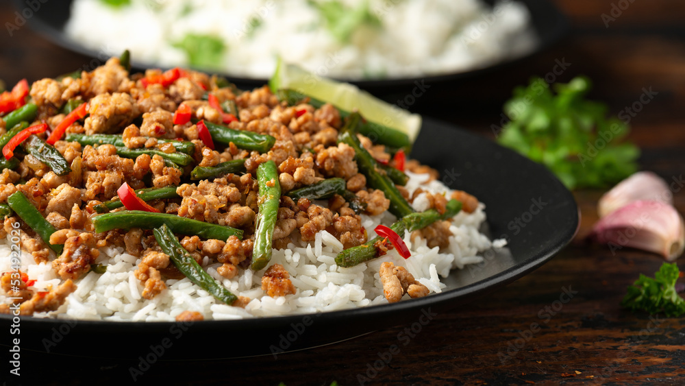 Pork Stir Fry with Green Beans, rice, garlic, chili and ginger. Asian food.