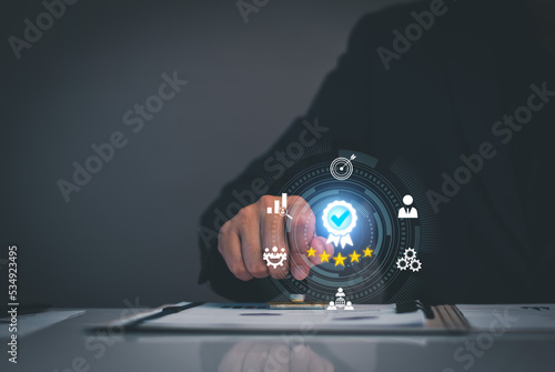 Quality Assurance Concept. Business people show high quality assurance mark, good service, premium, five stars, premium service assurance, excellence service, high quality, business excellence.