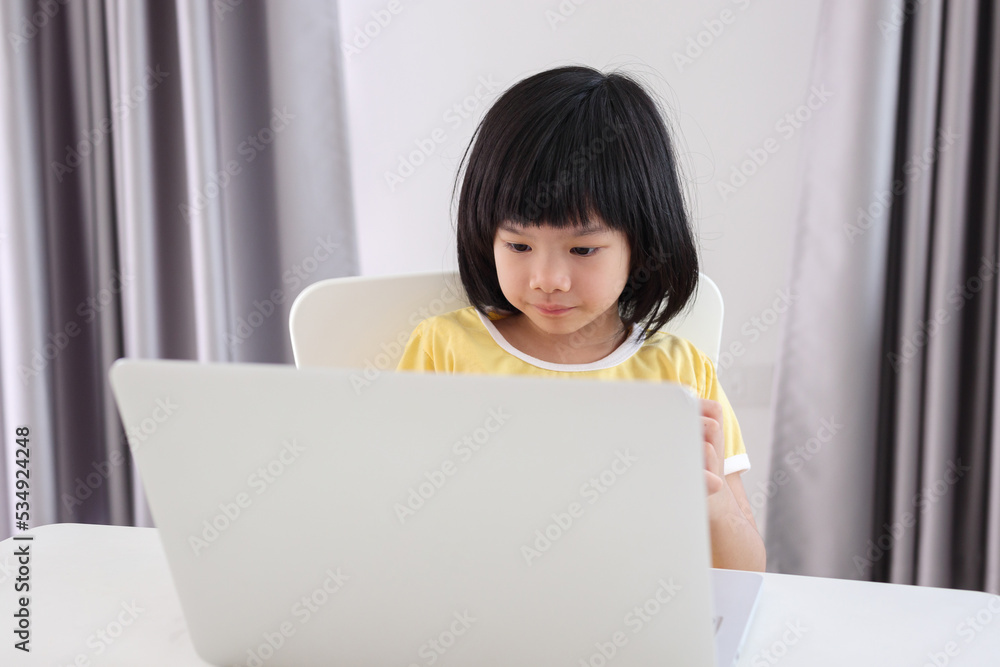 little asian girl student study online using laptop computer at home little asian girl student study online using laptop computer at home